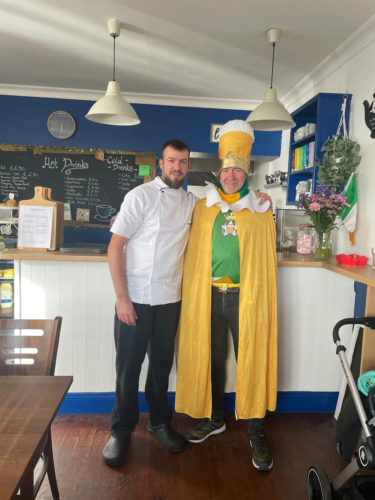 Interior showing staff, navy walls, white wainscoting, and chalkboard menu